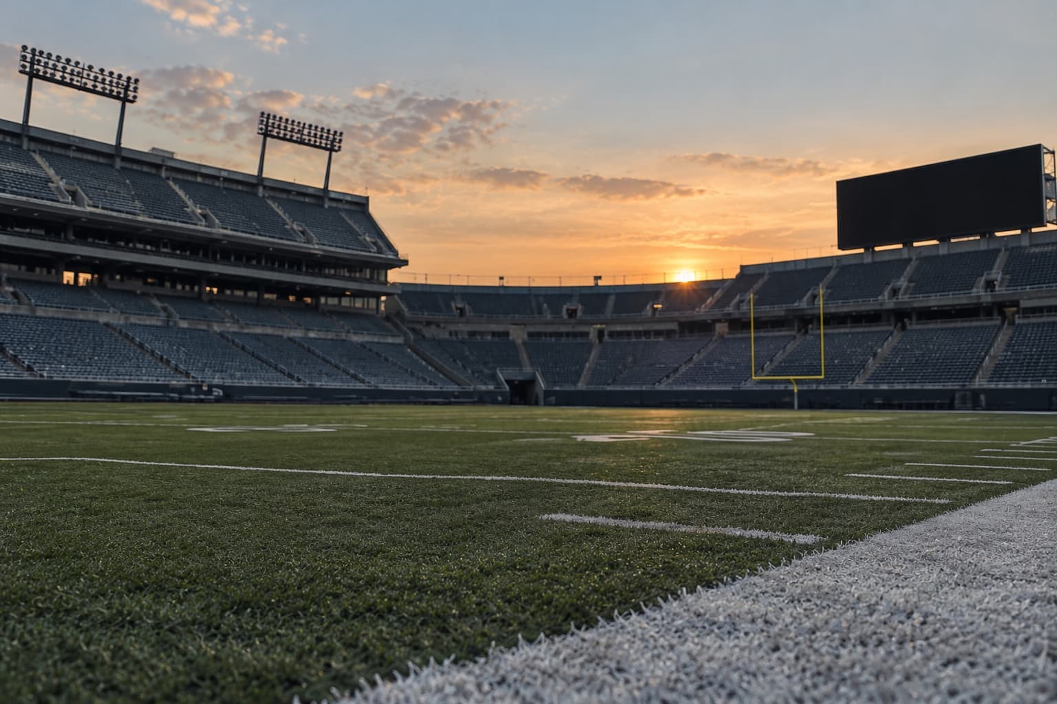 Empty football stadium at sunset before a fantasy football draft