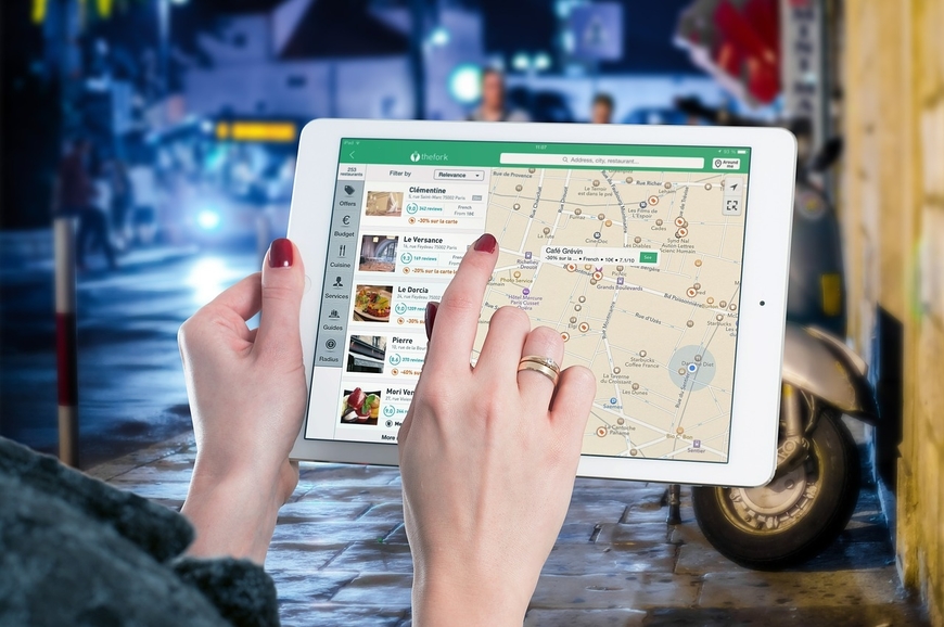 Search for Our Locations Woman Searching Locations on iPad